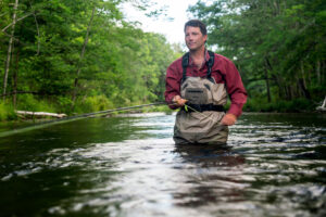 Fly fishing in a Downiest Maine river
